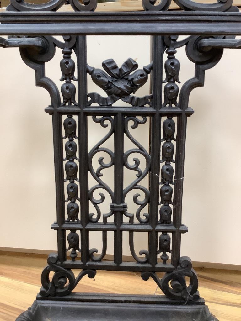 A cast iron umbrella stand